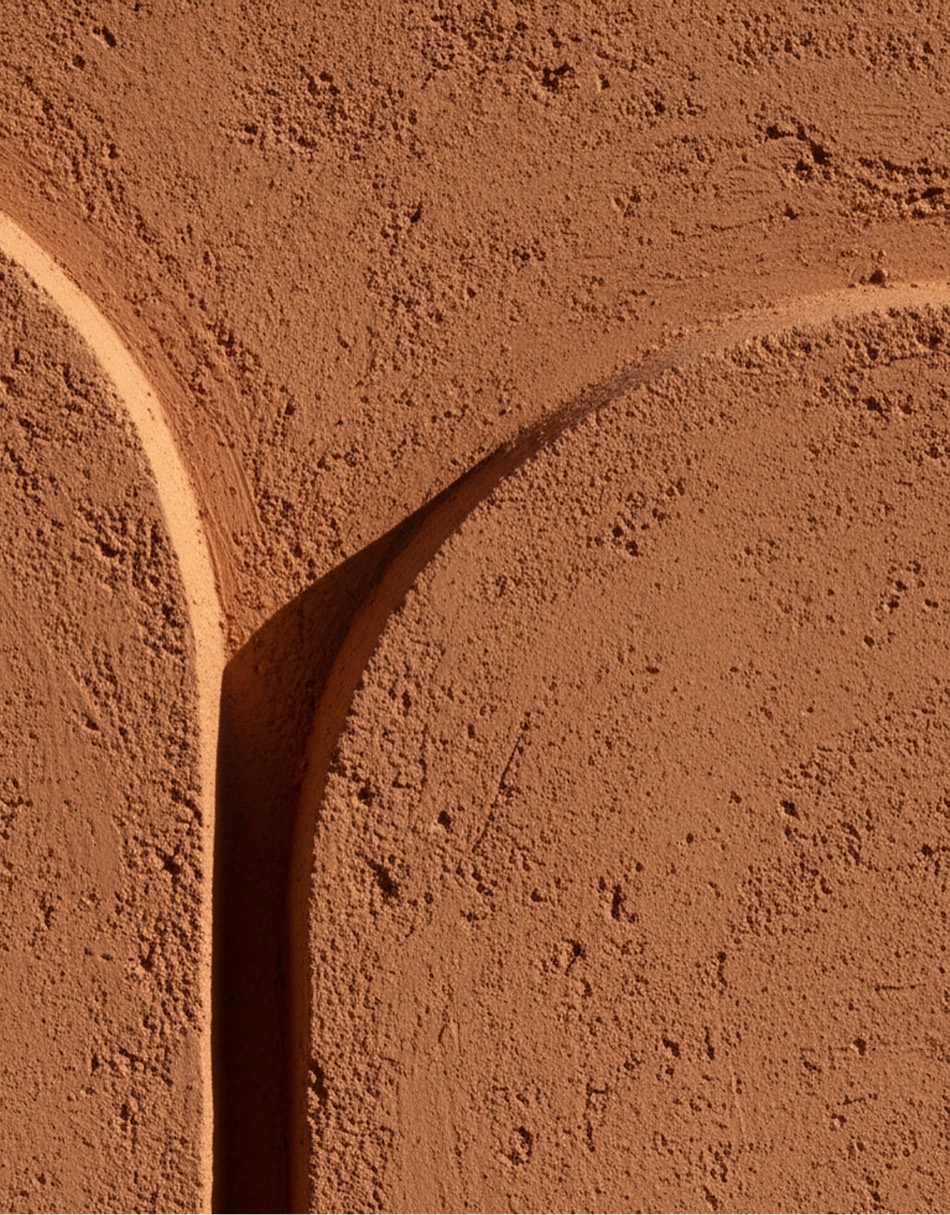 Textured plaster arches meeting in soft daylight — Arca Risk Management